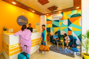 a group of people in a waiting room at The Social Stays Rishikesh in Rishīkesh