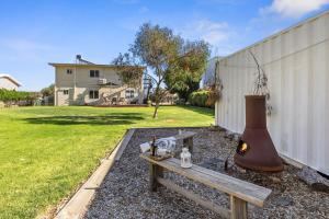 a bench and a fire hydrant in a yard at Carrickalinga SeaHaven in Normanville
