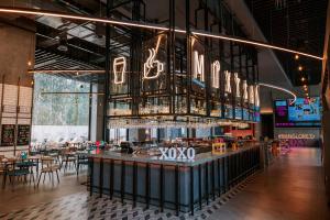 A restaurant or other place to eat at Moxy Bengaluru Airport Prestige Tech Cloud