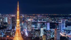a view of the tokyo tower at night at Henn na Hotel Tokyo Hamamatsucho in Tokyo