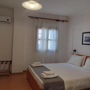 Postel nebo postele na pokoji v ubytování Anastasia Hotel