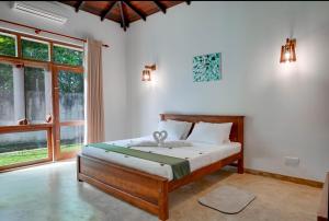 Ένα ή περισσότερα κρεβάτια σε δωμάτιο στο Mandari Villa +40 φωτογραφίες