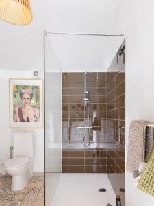 a bathroom with a shower and a toilet at LaChambre2 in Burdinne +7 photos