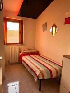 Postel nebo postele na pokoji v ubytování Casa Vacanze Azzurra