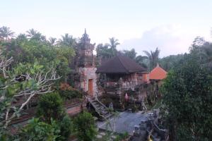 an old building in the middle of a forest at Gunung Kawi House & Villa in Tegalalang