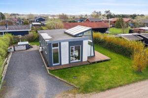 an overhead view of a tiny house on a yard at Modern Summer House With Fantastic Skylight, in Slagelse