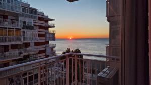 a view of the ocean from a balcony of a building at Perfect direct beach access in Benicàssim