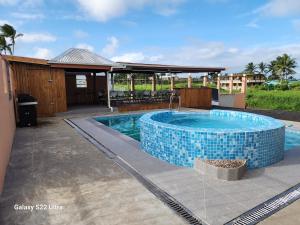 a swimming pool with a blue tiled poolvisor at BULA VIP LOUNGE in Suva