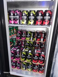 a refrigerator filled with lots of soda at BULA VIP LOUNGE in Suva