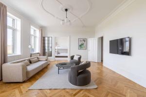 a living room with a couch and a table at 3 Bedroom Flat in Lovely Area in Copenhagen