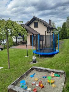 a playground in the yard of a house at Morycówka in Rzyki