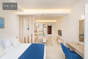 a bedroom with a bed and a living room at Prime Residence New Alamein in El Alamein