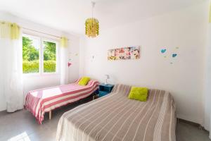 Postel nebo postele na pokoji v ubytování Villa de Maithe
