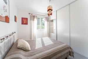 Postel nebo postele na pokoji v ubytování Villa de Maithe