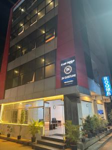 a building with a sign on the side of it at JN Guestline in Devanahalli-Bangalore