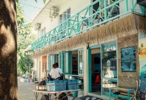 a person sitting on a cart outside of a store at Ocean Pearl Maldives at Gulhi Island in Gulhi