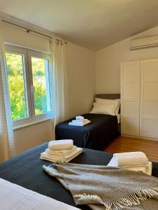 Postel nebo postele na pokoji v ubytování Apartments Curnić