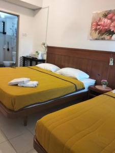 Postel nebo postele na pokoji v ubytování Lot 10 Pulau Pangkor