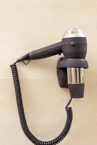 a telephone hanging on a wall at Apartamentos Sabinas Don Jaime in Zaragoza