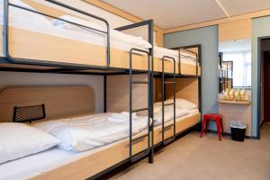 a room with bunk beds in a hostel at Sportcampus Saar in Saarbrücken