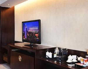 TV a/nebo společenská místnost v ubytování Nanyuan Universe Deluxe Hotel