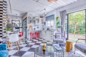 a kitchen with a checkered floor at The Bedford Manor in Centurion