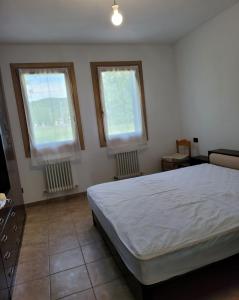 Postel nebo postele na pokoji v ubytování Casa dei Prati