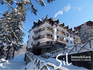 a hotel in the snow in the mountains at Mon Bijou in Sauze d'Oulx