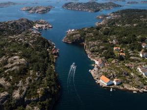 an aerial view of a boat in a river at Lunvig Romantic country house by the sea in Kristiansand, Søgne in Kristiansand