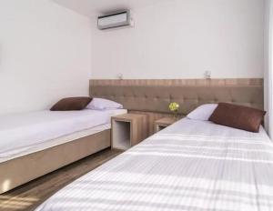 Postel nebo postele na pokoji v ubytování Rooms & Apartment Mama Mia