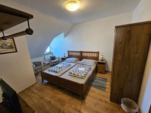 a bedroom with two beds in a room at St. Florian Restaurant & Pension in Vrakúň