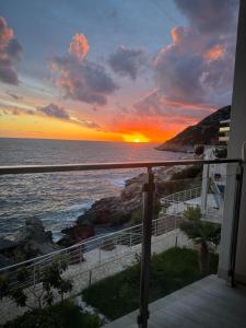 a sunset from the balcony of a house at Paradise beachfront view 2 in Dobra Voda