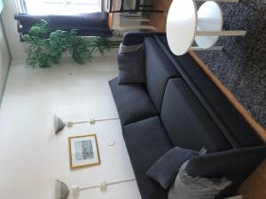 an overhead view of a living room with a couch at Hotell Turistgården i Simrishamn in Simrishamn