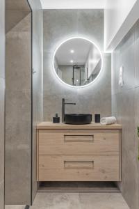 a bathroom with a sink and a mirror at Modern in a luxurious area - Super central - 6 pax in Oslo