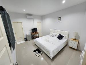 Postel nebo postele na pokoji v ubytování LD Guest House