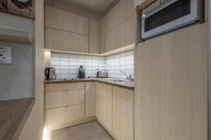 Kuchyňa alebo kuchynka v ubytovaní Casa Luxury Wellness Apartman By BLTN