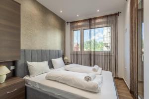 Posteľ alebo postele v izbe v ubytovaní Casa Luxury Wellness Apartman By BLTN
