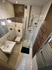 Koupelna v ubytování Omega Apartment