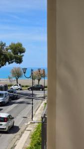 a view of a street with cars parked on the road at AD UN PASSO DAL MARE in Praia a Mare