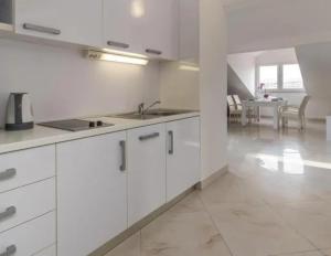 Kuchyň nebo kuchyňský kout v ubytování Rooms & Apartment Mama Mia