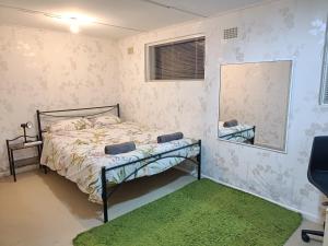 Voodi või voodid majutusasutuse Peaceful apartment in Beecroft with beautiful garden toas