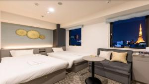 Postel nebo postele na pokoji v ubytování Henn na Hotel Tokyo Hamamatsucho