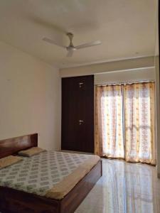 a bedroom with a large bed and a window at 636 Kedia Kothhi in Jaipur