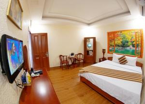 Postel nebo postele na pokoji v ubytování Kieu Anh Hotel Vung Tau