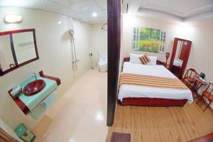Postel nebo postele na pokoji v ubytování Kieu Anh Hotel Vung Tau