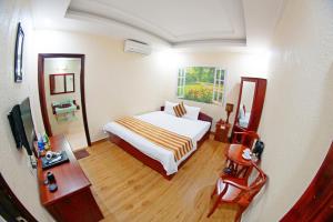 Postel nebo postele na pokoji v ubytování Kieu Anh Hotel Vung Tau
