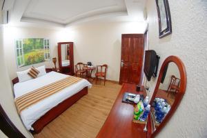 Postel nebo postele na pokoji v ubytování Kieu Anh Hotel Vung Tau