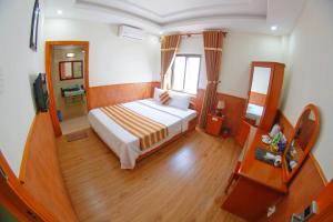 Postel nebo postele na pokoji v ubytování Kieu Anh Hotel Vung Tau