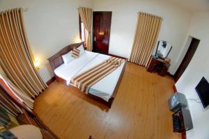 Postel nebo postele na pokoji v ubytování Kieu Anh Hotel Vung Tau