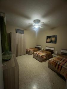 Postel nebo postele na pokoji v ubytování Chaltan Apartments